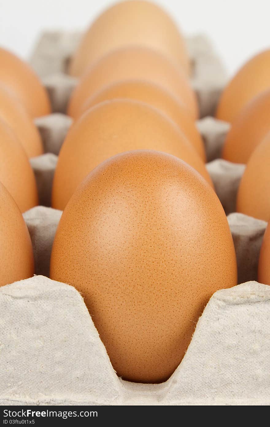 Background of brown eggs in box. Background of brown eggs in box