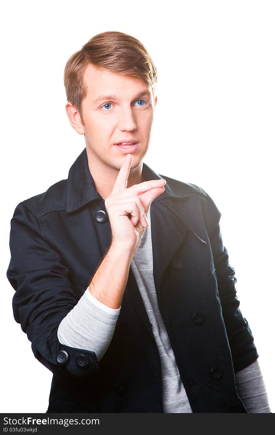 Portrait of gesticulating young man wearing black jacket on isolated white background