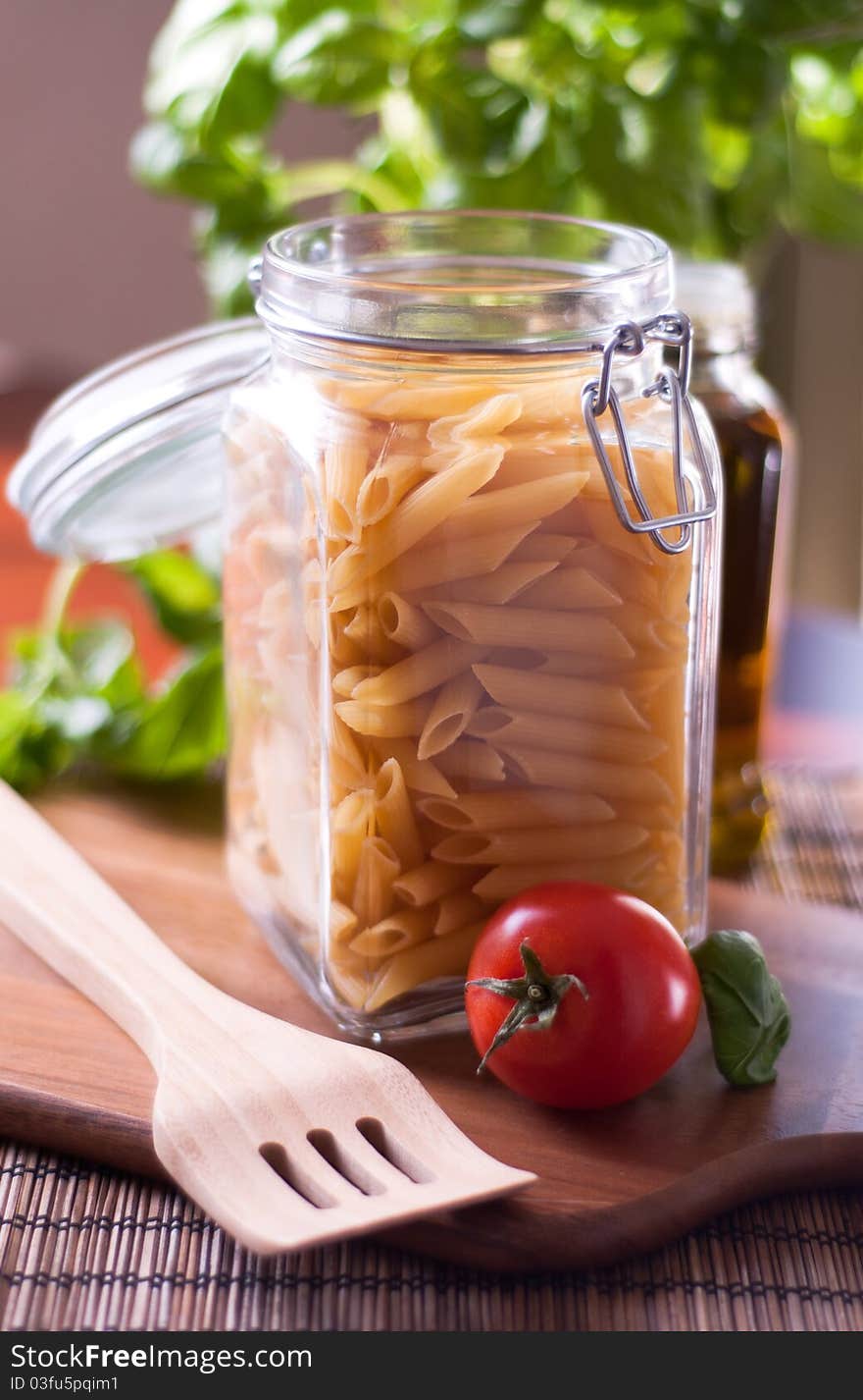 Dried penne pasta on the kitchen table