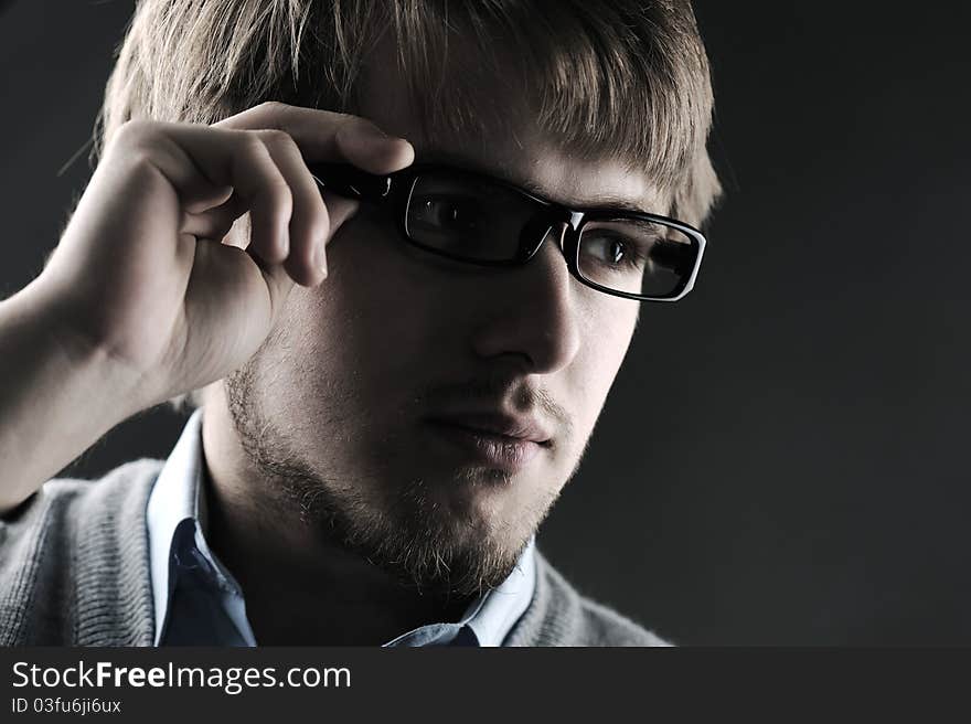 Portrait of a handsome stylish man with glasses