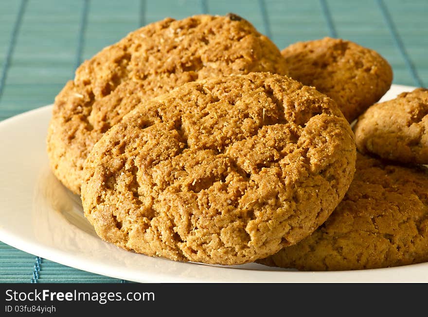 Oatmeal cookies lay on a plate