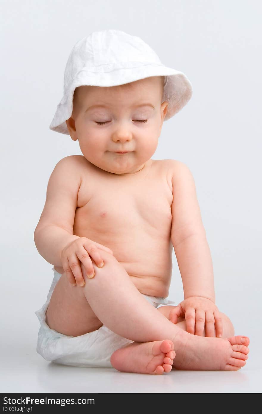 Infant closeds eyes expectative surprise, on white background. Infant closeds eyes expectative surprise, on white background.