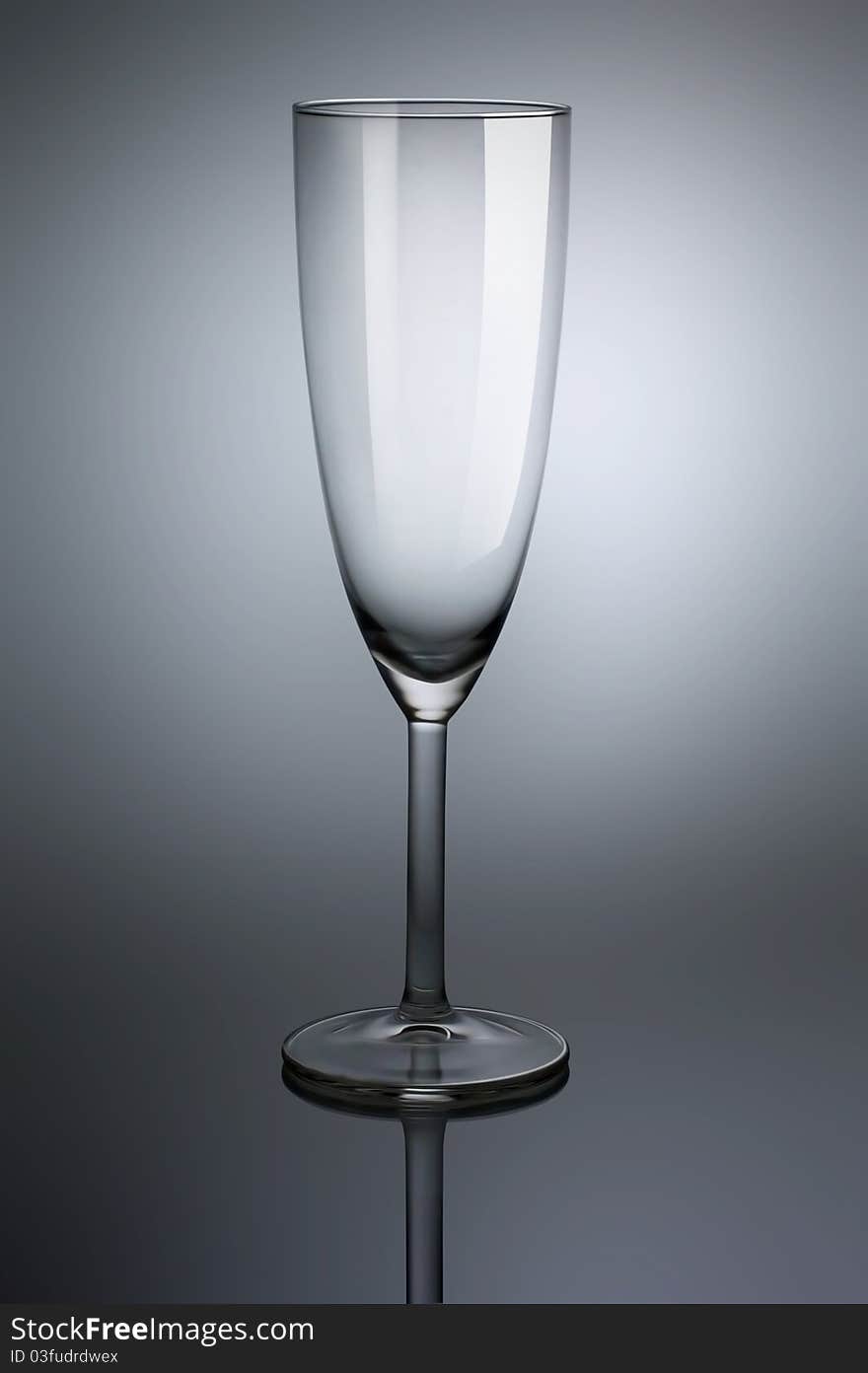 Empty glass goblet with reflection