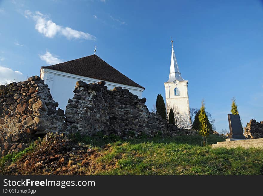 Very old unitarian church surrounded by ancient defence stone walls (XII Century) in Chilieni (Kylen), Covasna county, Transylvania, Romania