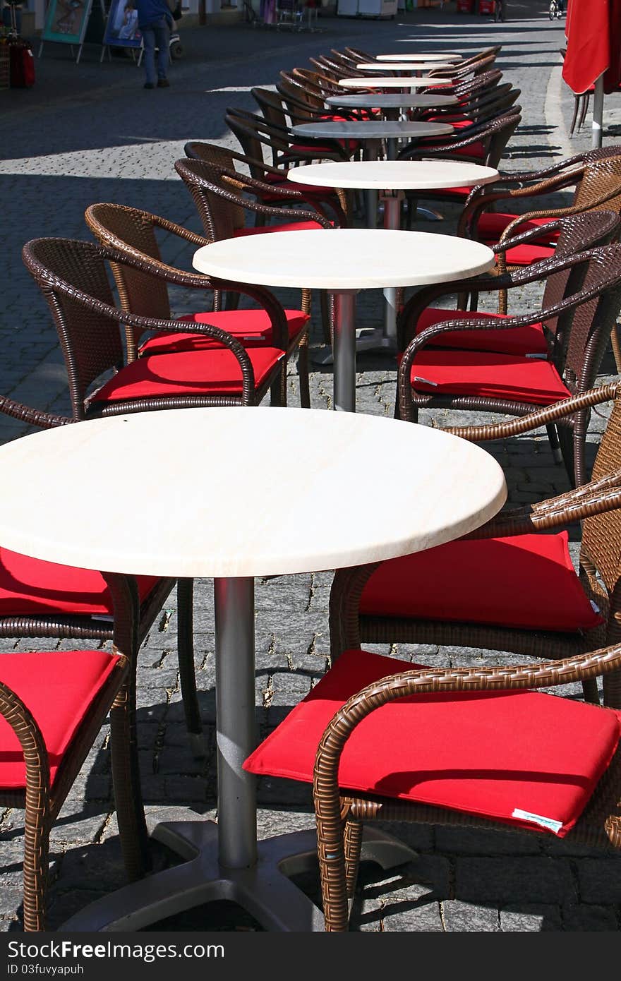 Coffee tables in a pedestrian area in springtime