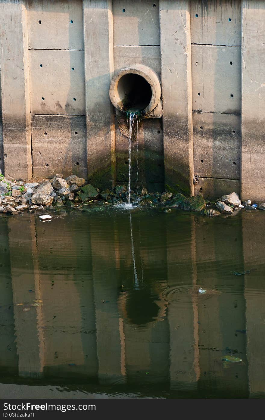 Waster water drainage pipe near by a canal