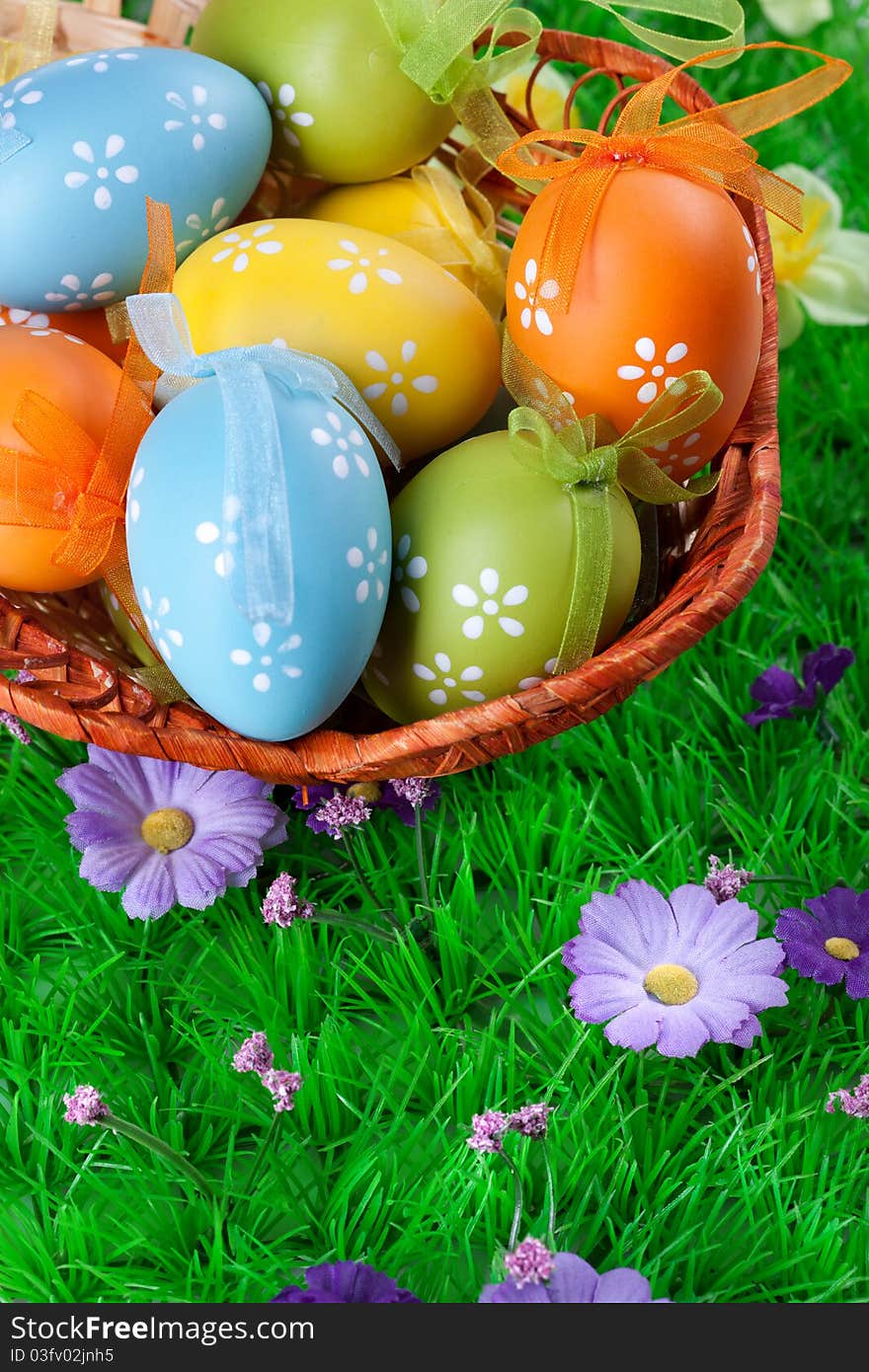 Color easter eggs in basket