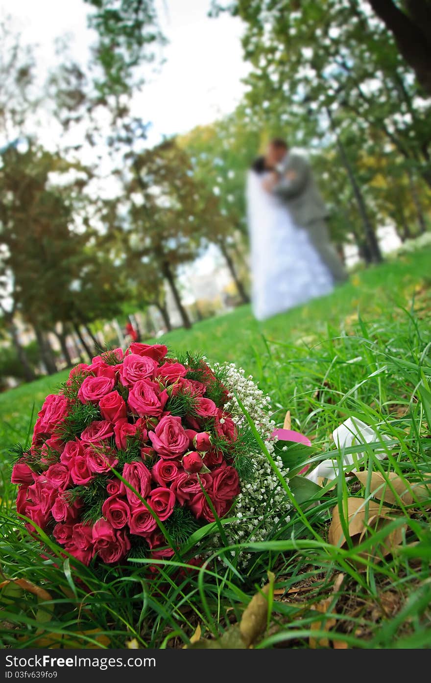 Wedding bouquet lying on a green grass