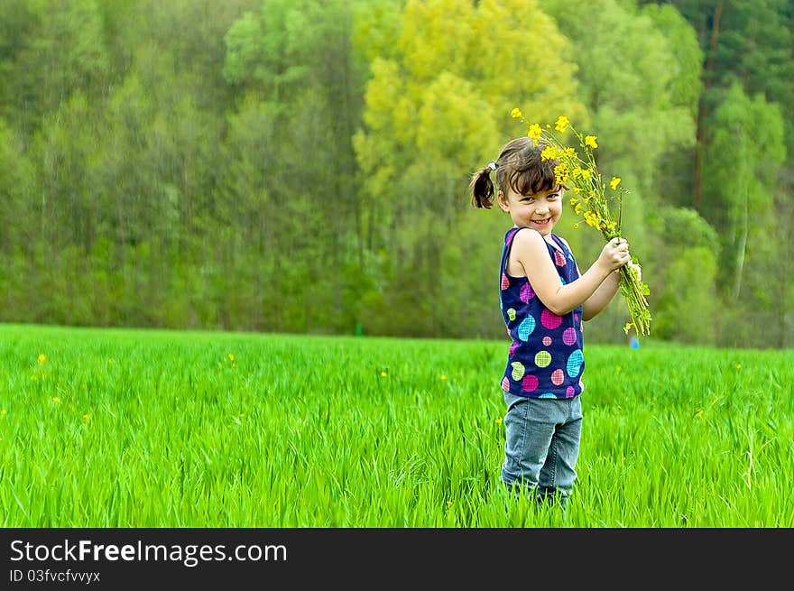 Little girl with flowers outdoors