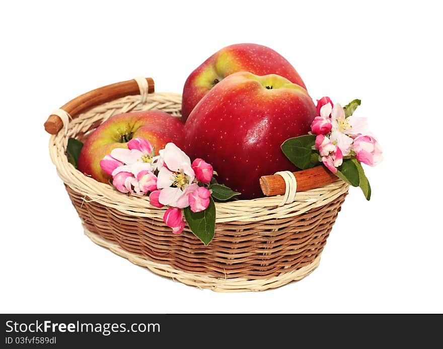 Red apples with flowers in a basket. Red apples with flowers in a basket