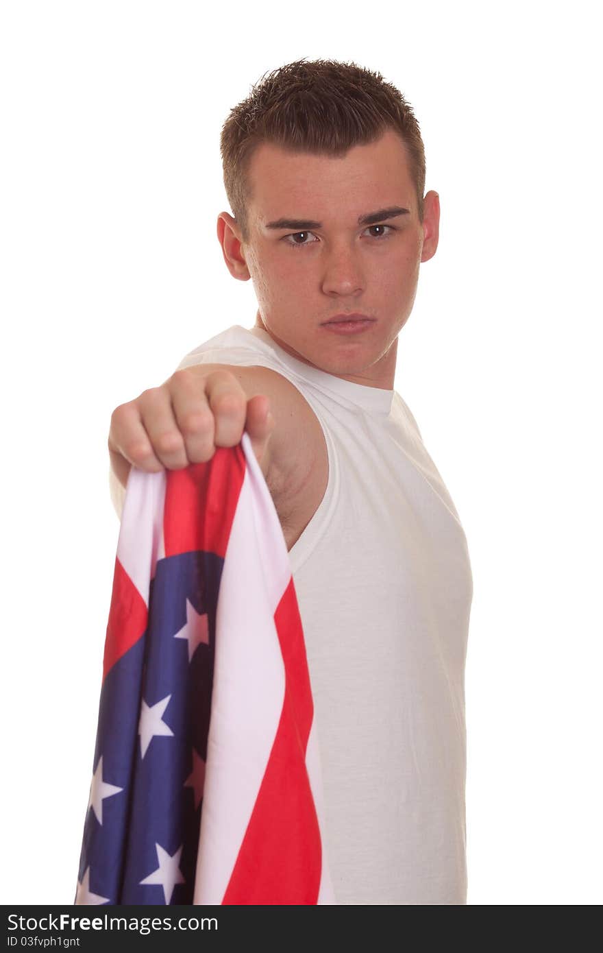 An isolation of an athletic young man holding an american flag. An isolation of an athletic young man holding an american flag.