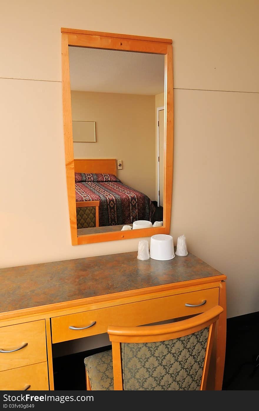 Typical and generic dressing area in bedroom with mirror. Typical and generic dressing area in bedroom with mirror.