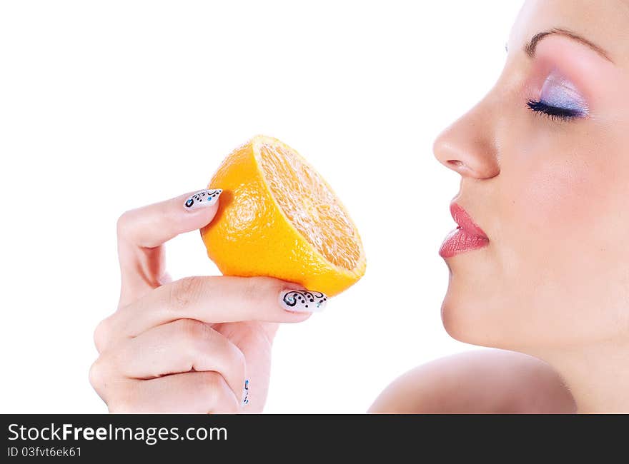 Close up photo of a women with orange. Close up photo of a women with orange