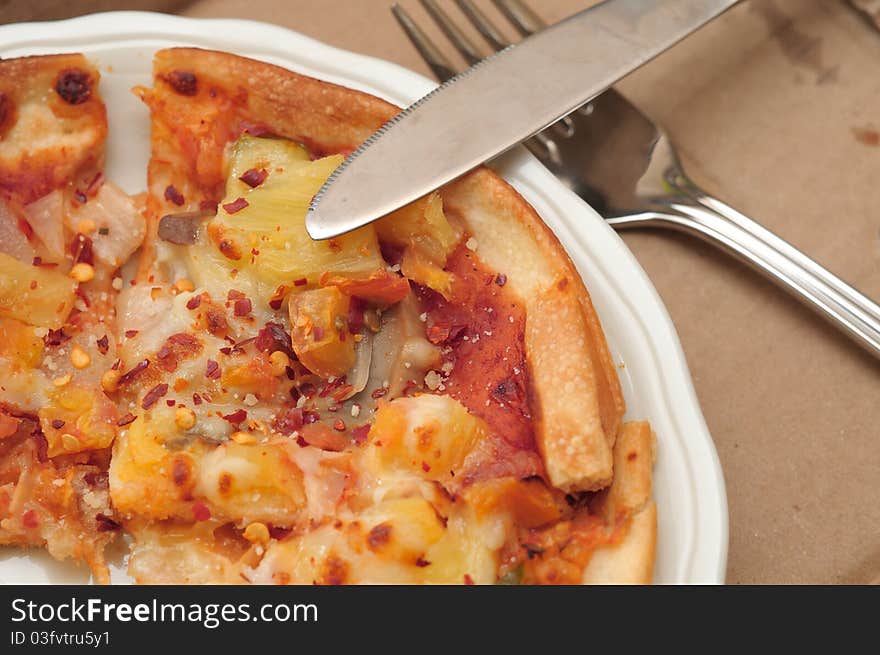 Closeup of freshly baked Italian pizza on white plate. Closeup of freshly baked Italian pizza on white plate.