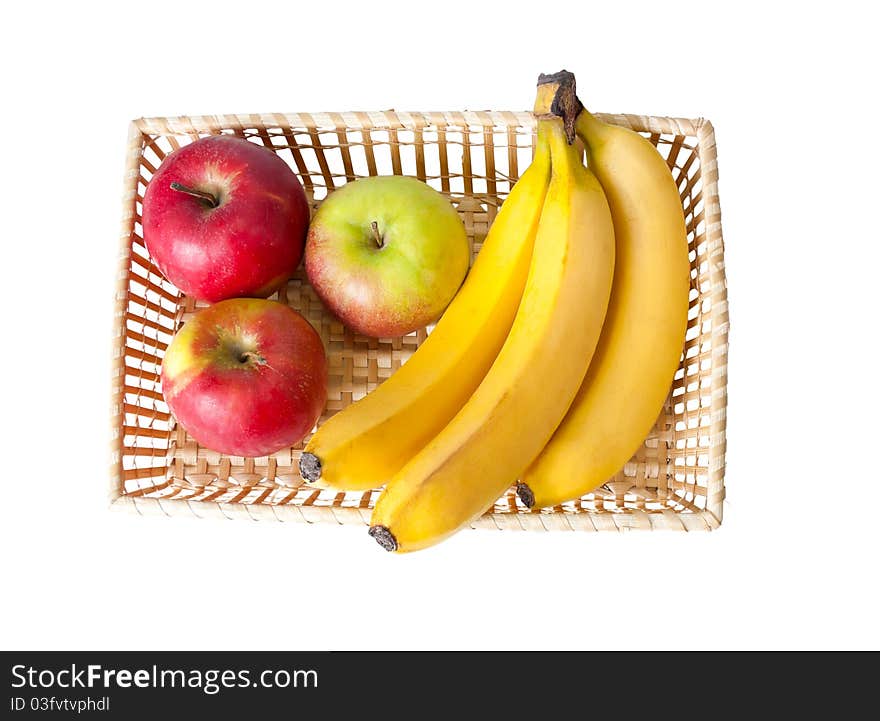 Straw basket of fruit on a white background. Straw basket of fruit on a white background