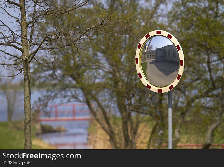 Road traffic mirror sunny tree. Road traffic mirror sunny tree