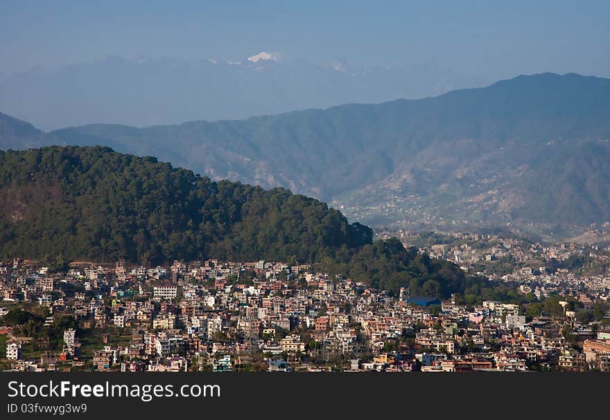 A top of Langtang Lirung mountain (the highest peak in Langtang range, 7225m) in snow seen over Kathmandu Valley. A top of Langtang Lirung mountain (the highest peak in Langtang range, 7225m) in snow seen over Kathmandu Valley.