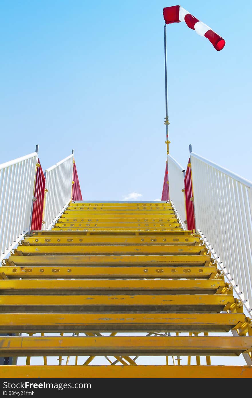 Yellow stairway with inflated windsock on its peak. Yellow stairway with inflated windsock on its peak.