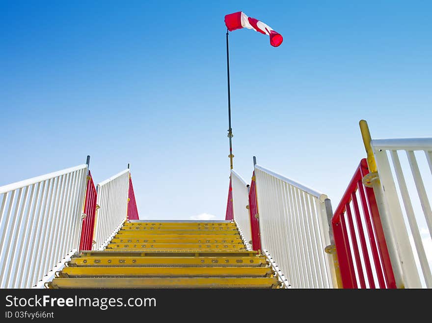 Yellow stairway with inflated windsock on its peak. Yellow stairway with inflated windsock on its peak.