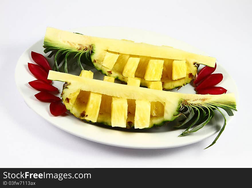 Two pineapple on white plate