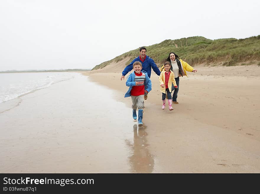 Happy Family On Beach