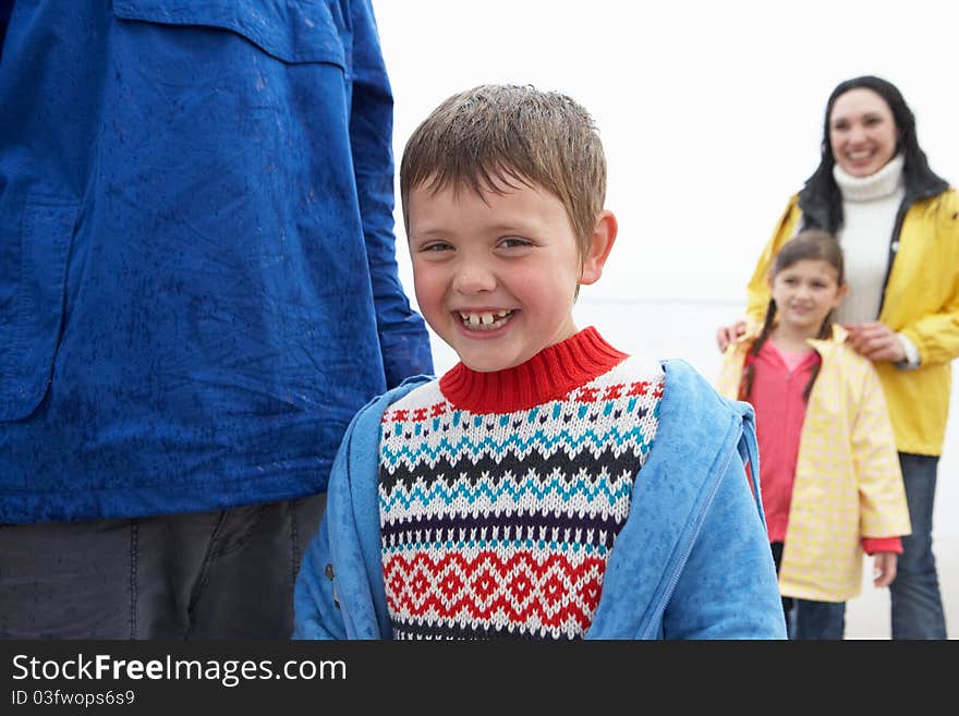 Happy family on beach smiling