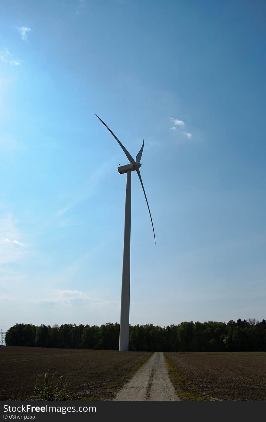 Wind turbines farm on sunset