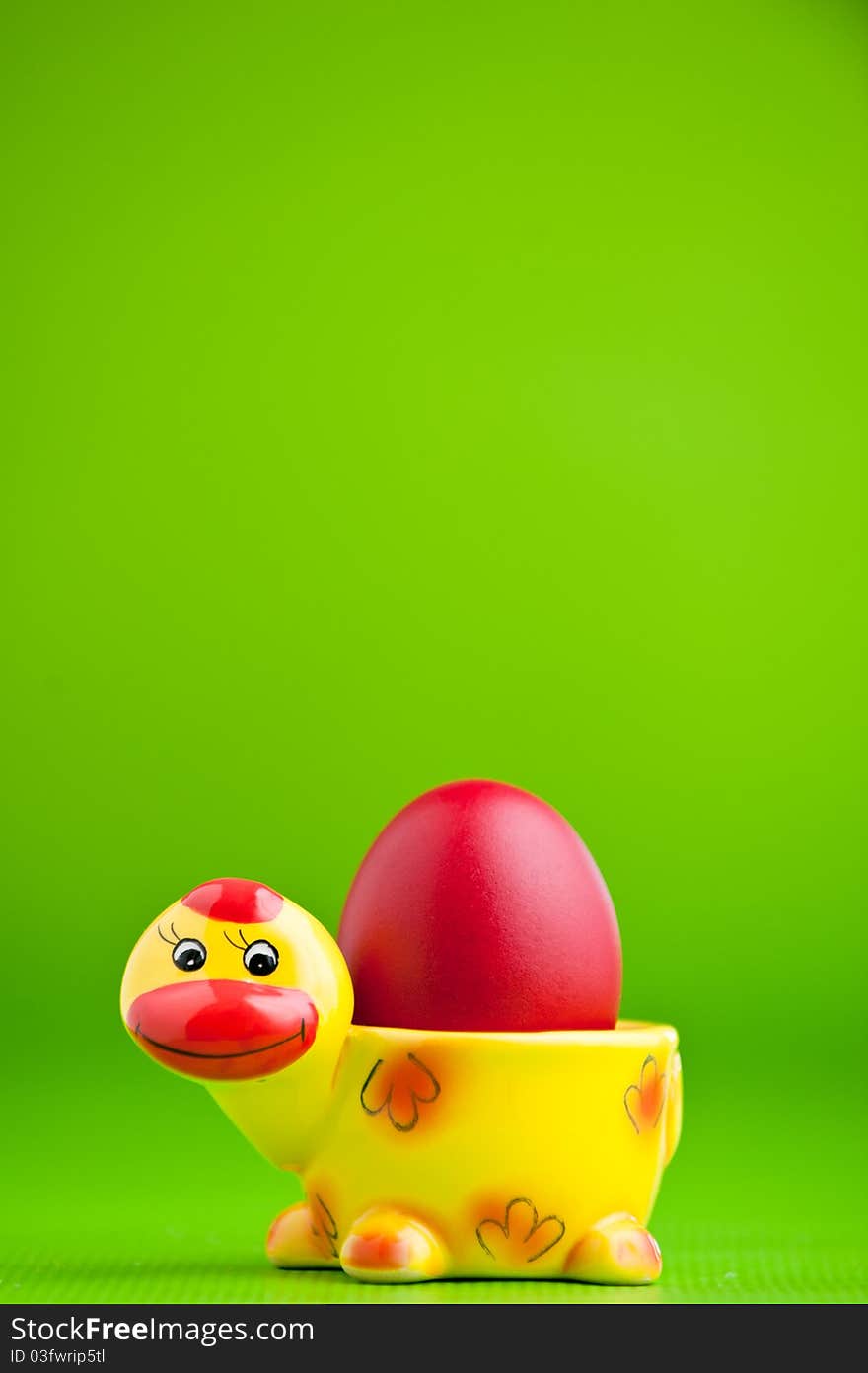 Colorful easter egg isolated over a green background