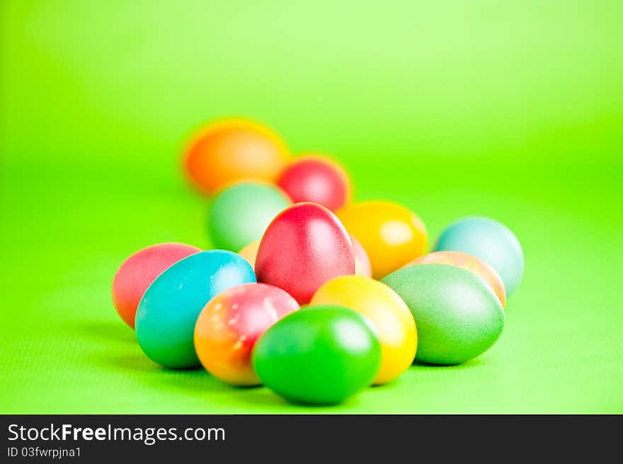 Colorful easter eggs isolated over a green background