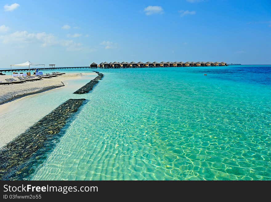 Maldive water villa and blue sea