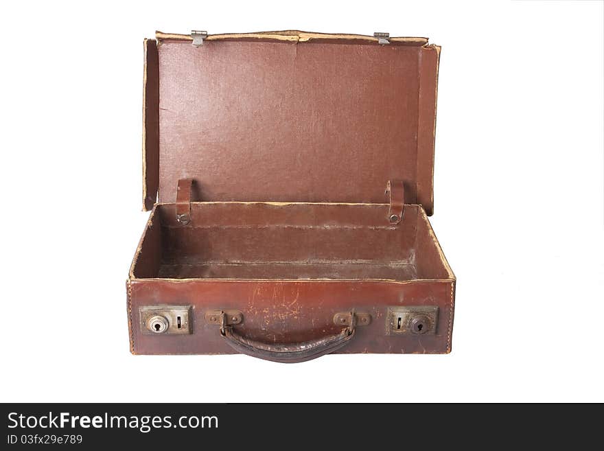 Old brown vintage antique open empty suitcase on white. Old brown vintage antique open empty suitcase on white