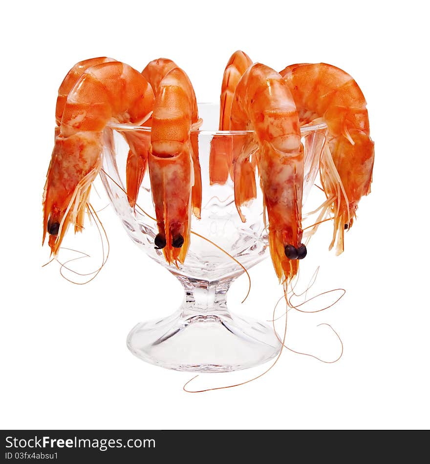 Fresh shrimps in glass cup isolated over white background. Fresh shrimps in glass cup isolated over white background.