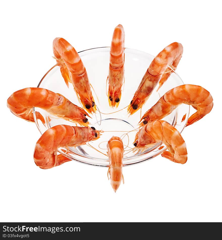 Fresh shrimps in glass bowl isolated over white background. Fresh shrimps in glass bowl isolated over white background.