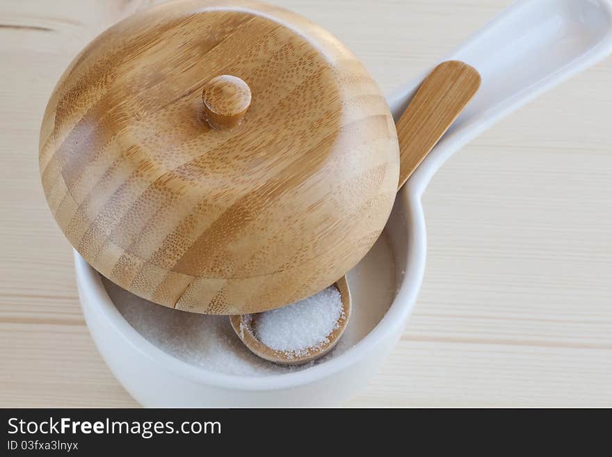 Sugar bowl with a wooden spoon