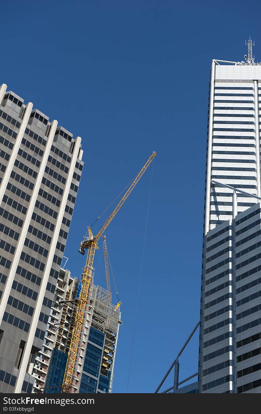 Upward View of Construction Site and Skyscraper in Perth Business District, Western Australia. Upward View of Construction Site and Skyscraper in Perth Business District, Western Australia