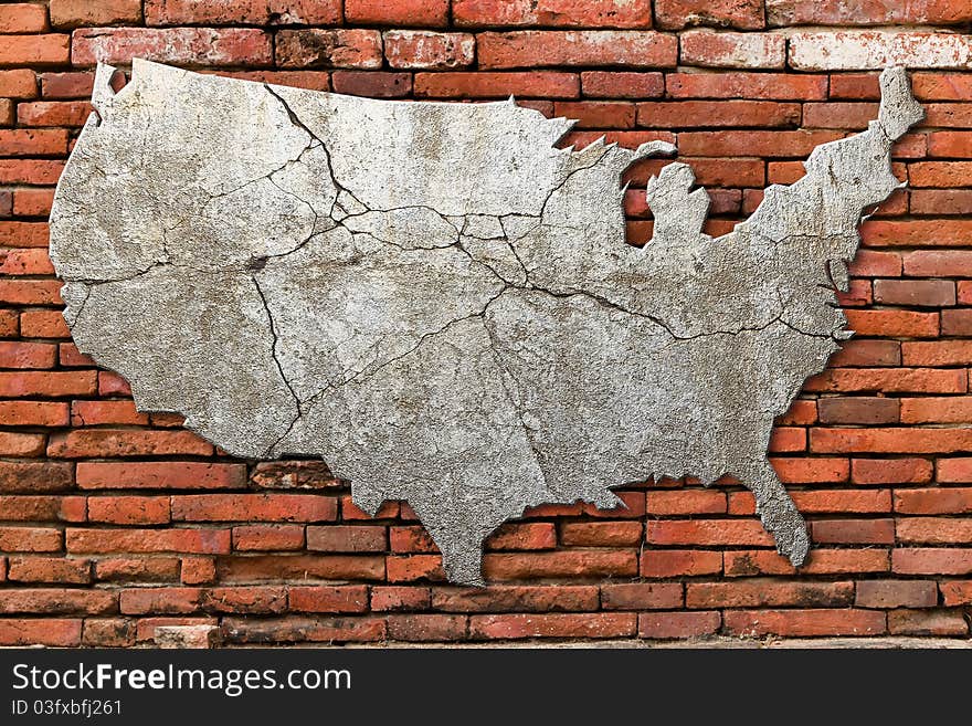 Cement cracking image United State map on Red brick wall