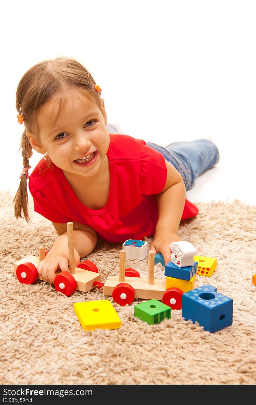 Smile girl playing with wood toys. Smile girl playing with wood toys