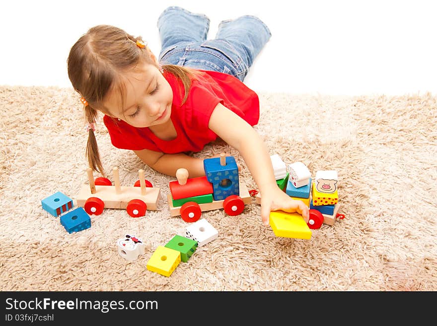 Cute little girl playing on the floor. Cute little girl playing on the floor