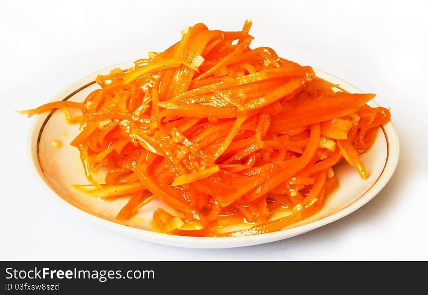 Carrot diet salad on the plate isolated on white background. Carrot diet salad on the plate isolated on white background