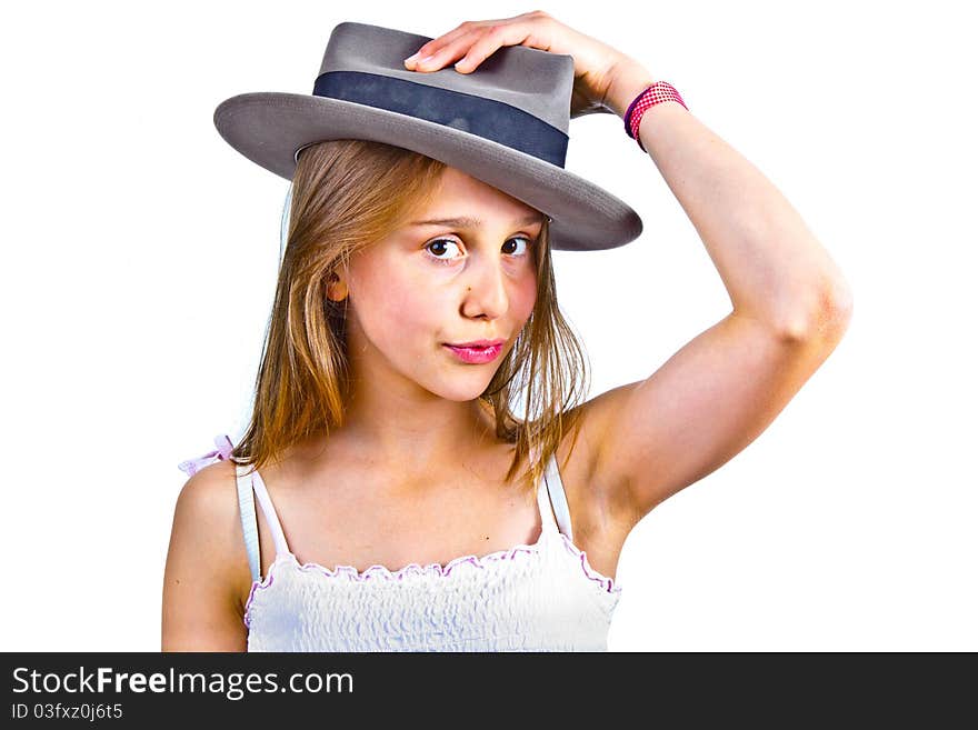 Portrait of cute young teenage girl with hat