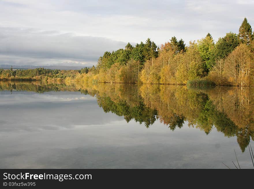 Reflections on a Scottish Lochen (small loch) near Blairdrummond in Stirlingshire. Reflections on a Scottish Lochen (small loch) near Blairdrummond in Stirlingshire