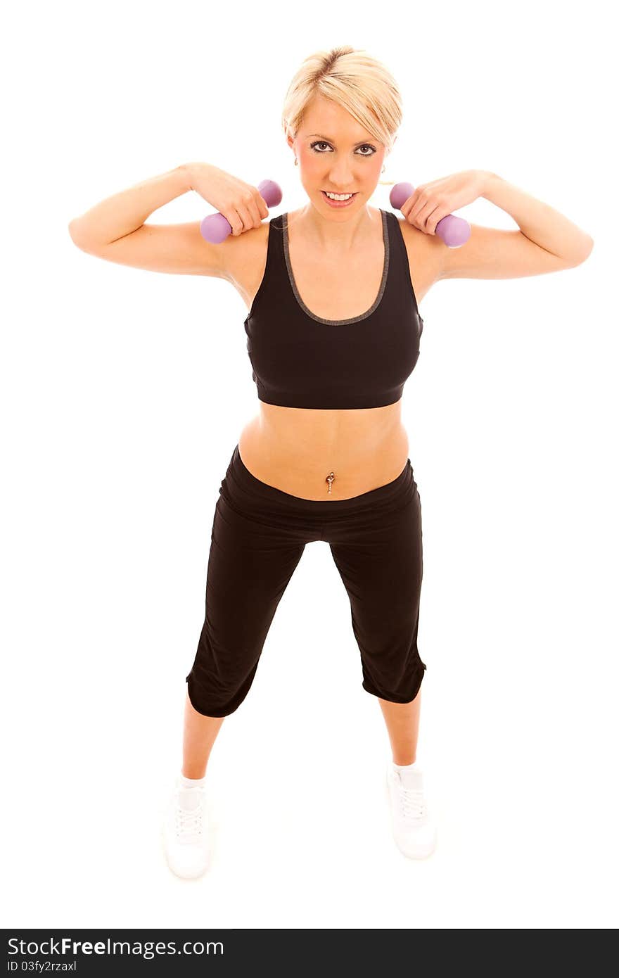 A young female performing a weight training exercise on isolated white background