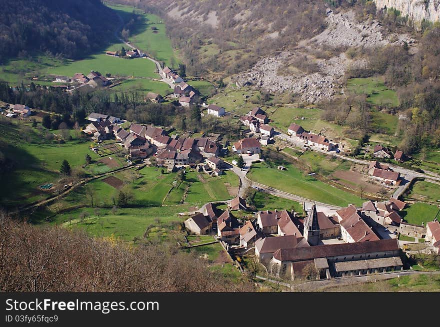 Panoramic view on old authentic french village and abbey in natural canyon. Cirque de Baume les Messieurs, France, Comte. Panoramic view on old authentic french village and abbey in natural canyon. Cirque de Baume les Messieurs, France, Comte