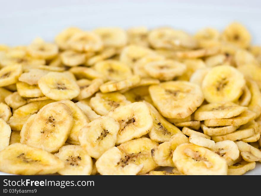 Dried banana slices on the white