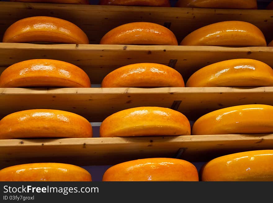 Cheese rounds - or wheels at a Market . Cheese rounds - or wheels at a Market .