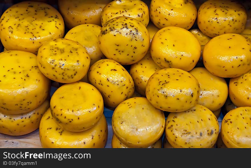 Cheese rounds - or wheels at a Market . Cheese rounds - or wheels at a Market .