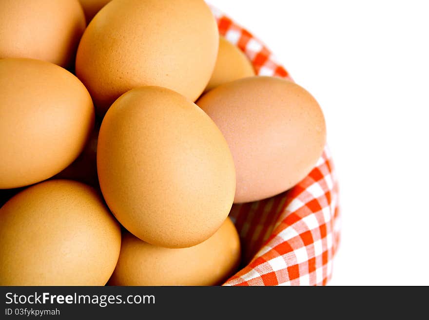 Basket full of eggs, isolated on white