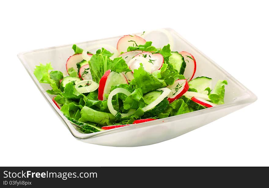 Fresh vegetable salad in a plate over white