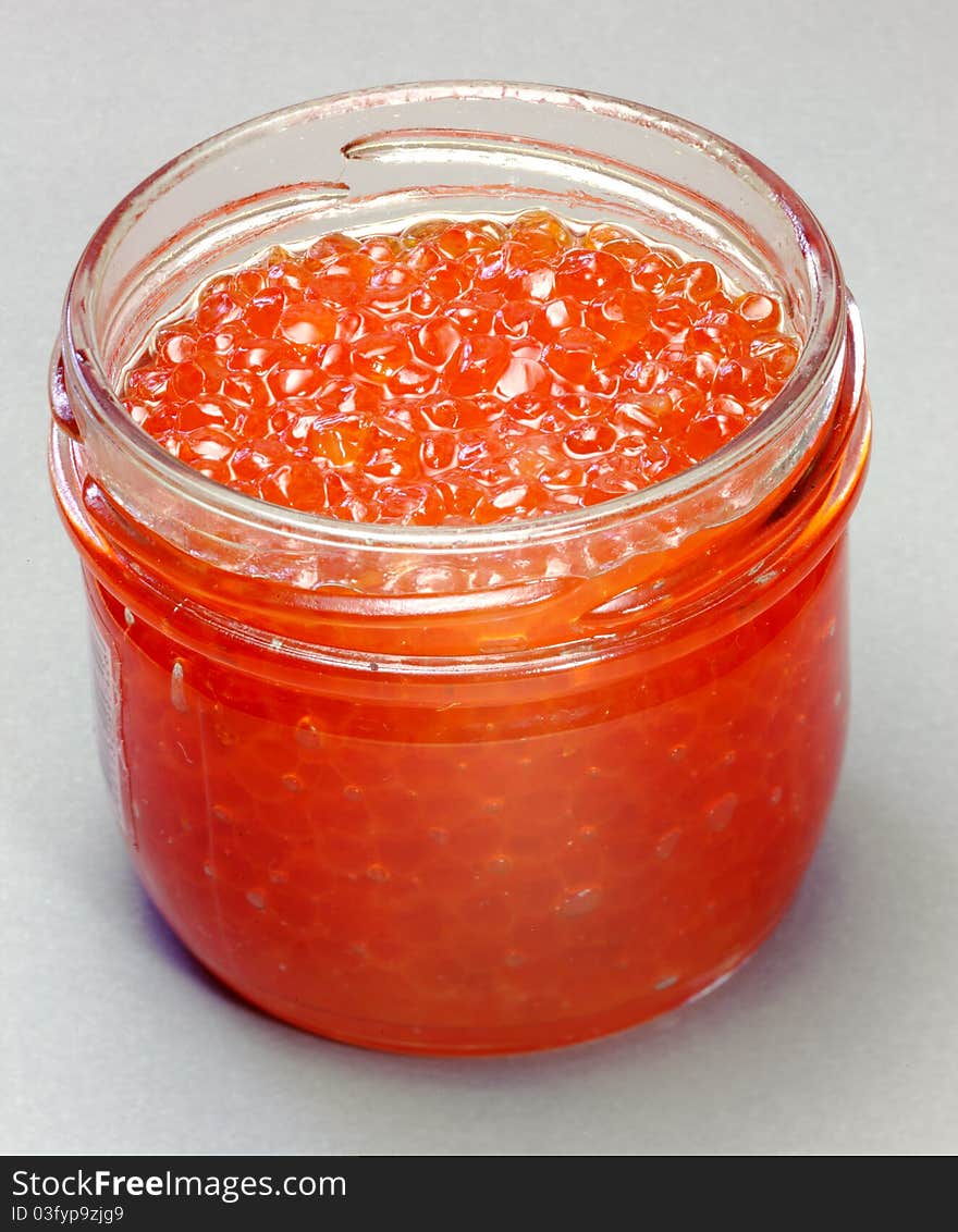 Delicacy. Canned. Red caviar in a glass jar. Delicacy. Canned. Red caviar in a glass jar.