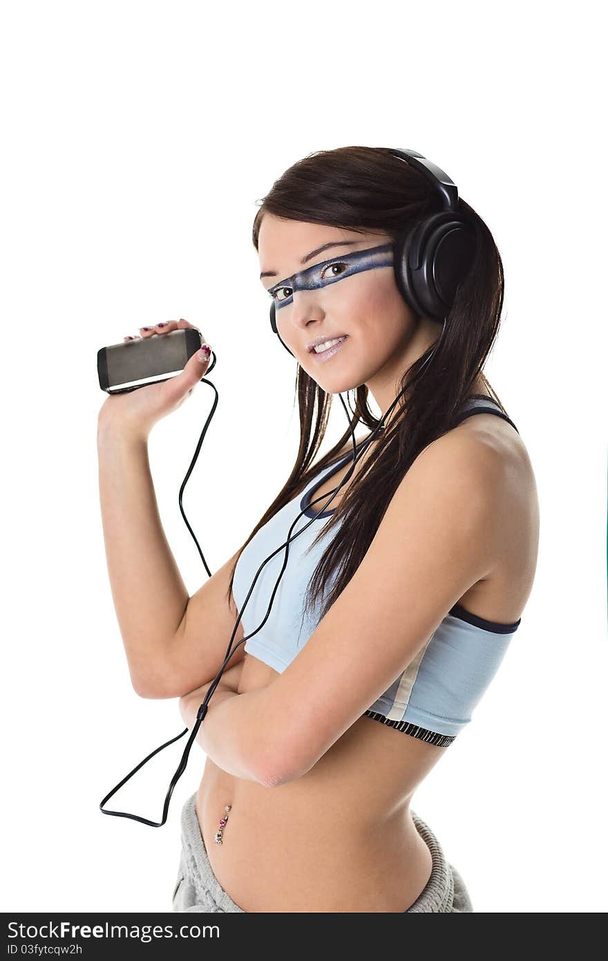 Beautiful young girl listens to her favorite tunes. Beautiful young girl listens to her favorite tunes